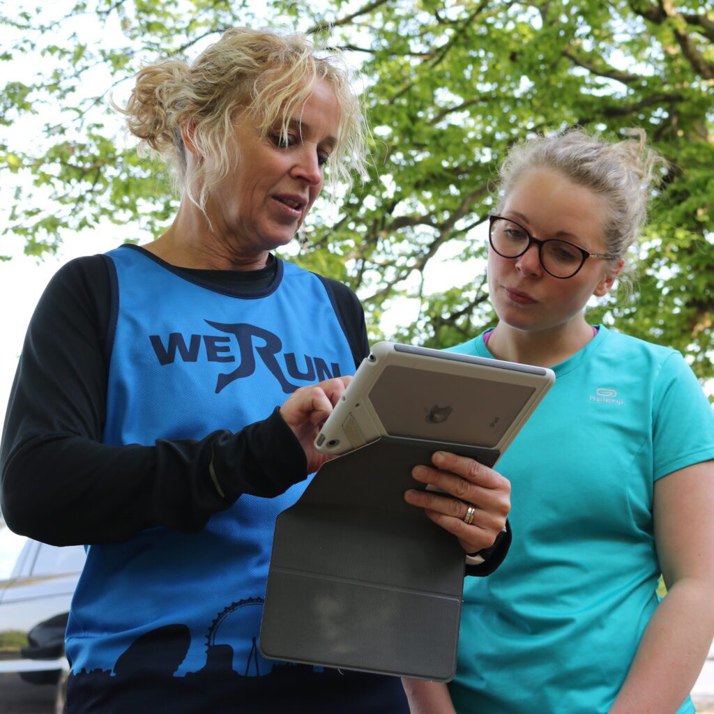 running coach teaching a runner