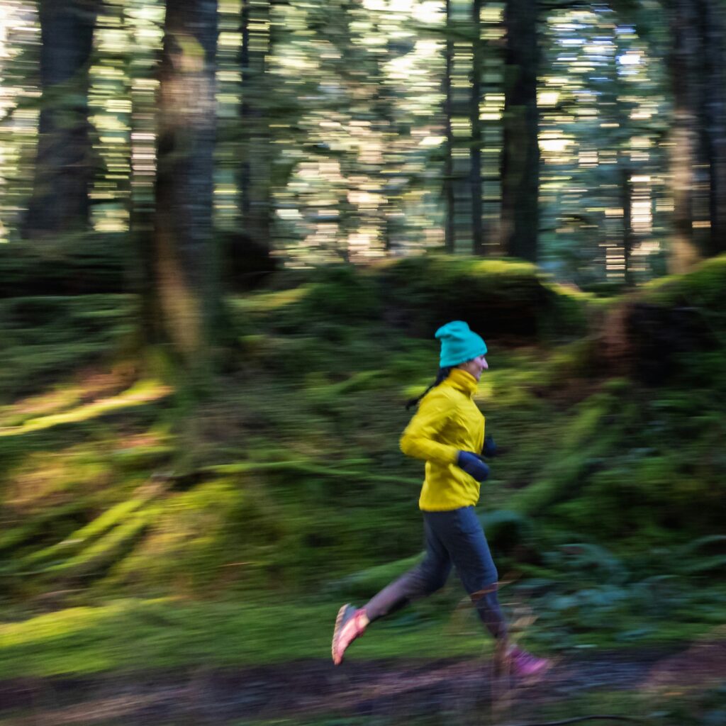 running coach oldham lady running with wood backgrounds