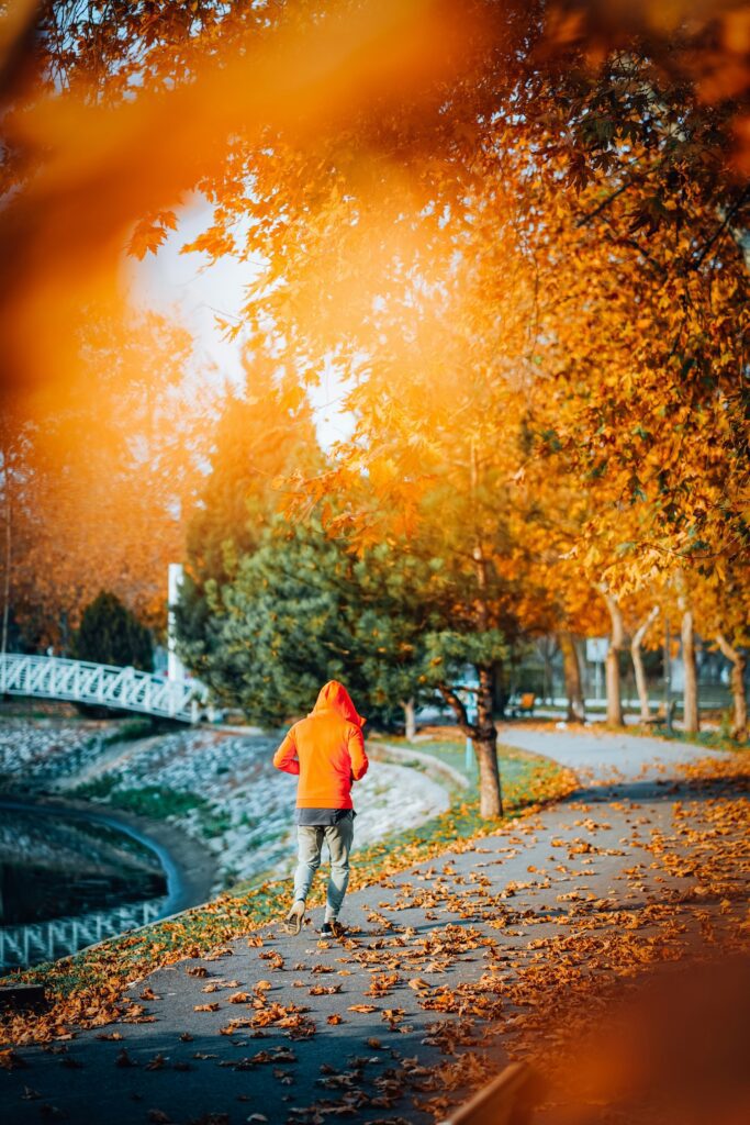 running coach oldham man in orange hoodie